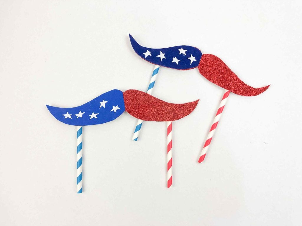 Are you looking for a fun and patriotic craft to celebrate American holidays like Memorial Day, Independence Day, and Labor Day? These super cute Red White and Blue Crafts are perfect! Look no further. In this blog post, we'll walk you through a step-by-step tutorial on creating a unique and exciting mustache topper craft that showcases the red, white, and blue spirit. 