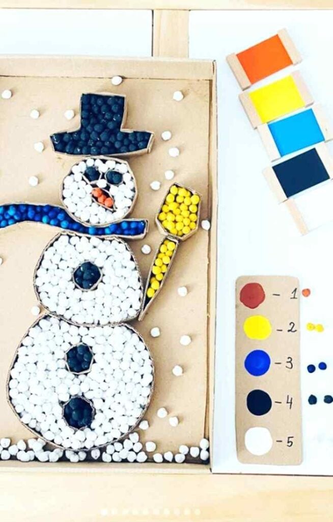 Elevate winter crafting with these Snowman Pom Pom Cardboard Fill Craft. It's a delightful blend of creativity and learning, perfect for little ones.