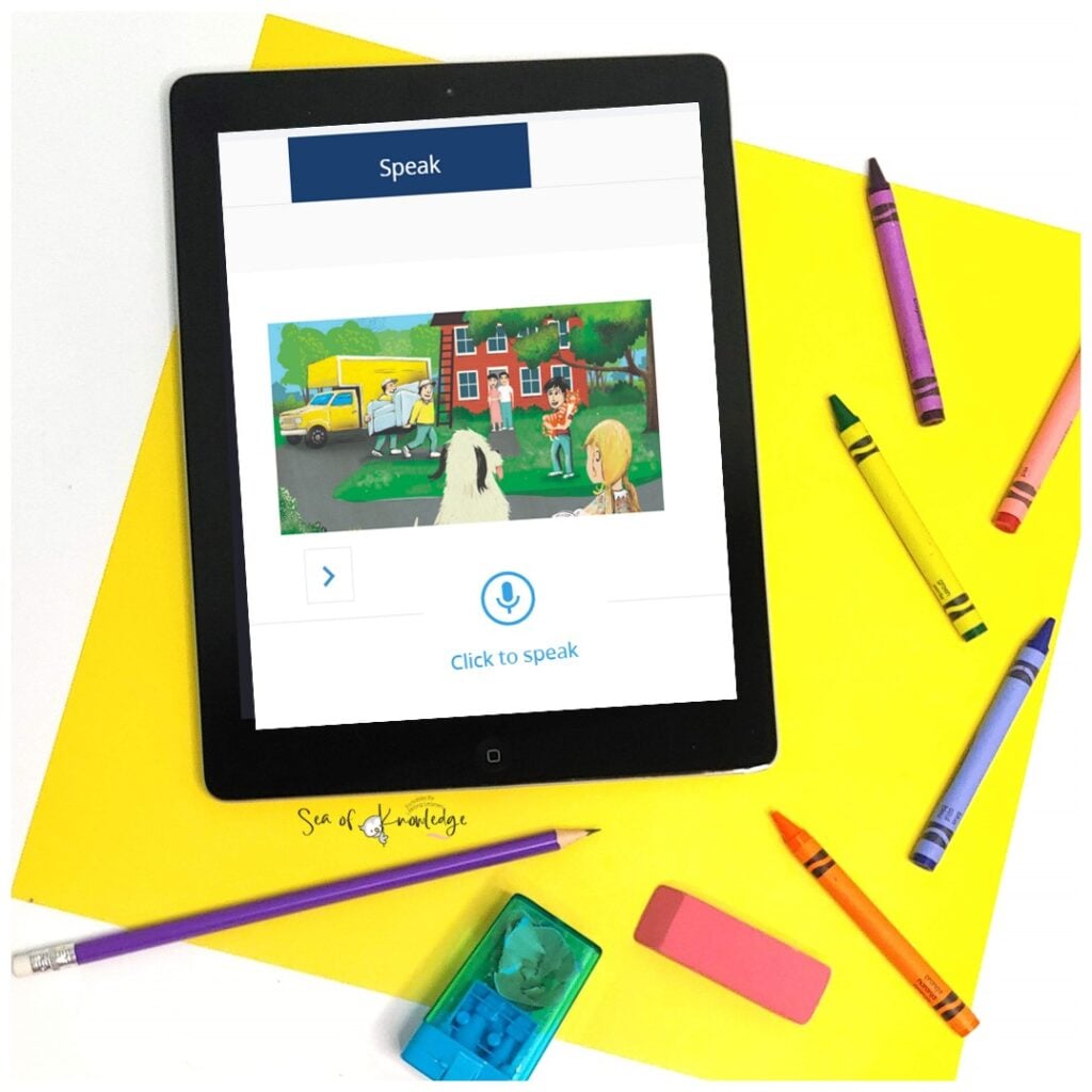 Teacher working with two ESL students using Rosetta Stone on a smartboard during a small group session