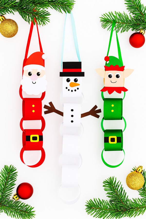 Christmas paper chain craft in red, green, and white with Santa faces
