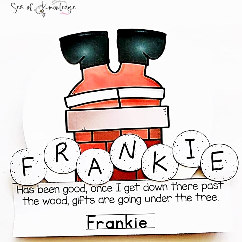 Santa chimney craft with student writing good deeds for a classroom bulletin board