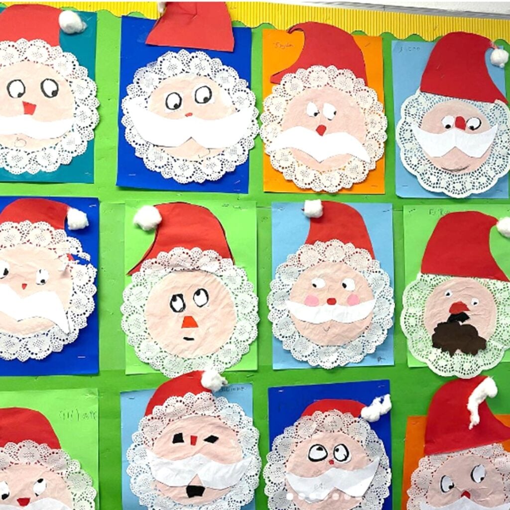 Large classroom mural made from red tablecloth pieces forming a giant Santa face