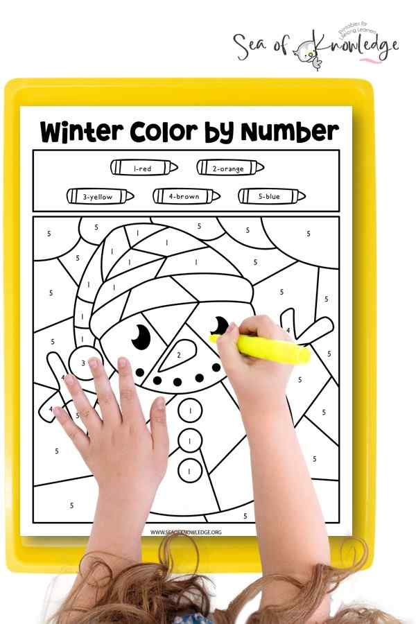 Color by number Santa coloring sheet with crayons and finished artwork