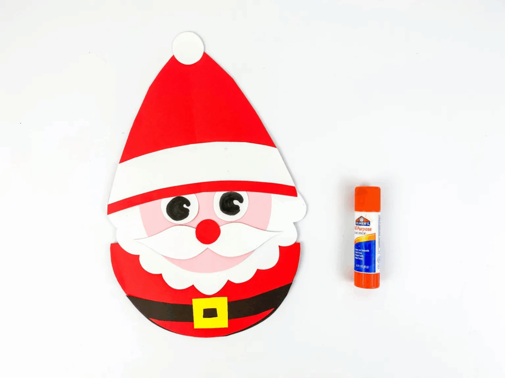 Rocking paper Santa craft wobbling on curved base with white cotton trim