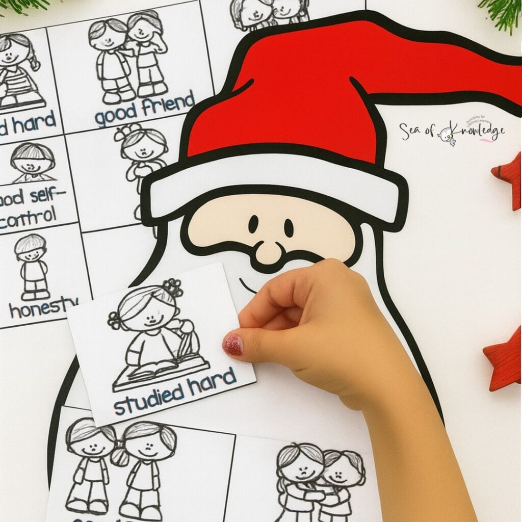 preschooler letter to santa. Child cutting and pasting a letter to Santa template during writing center activity 