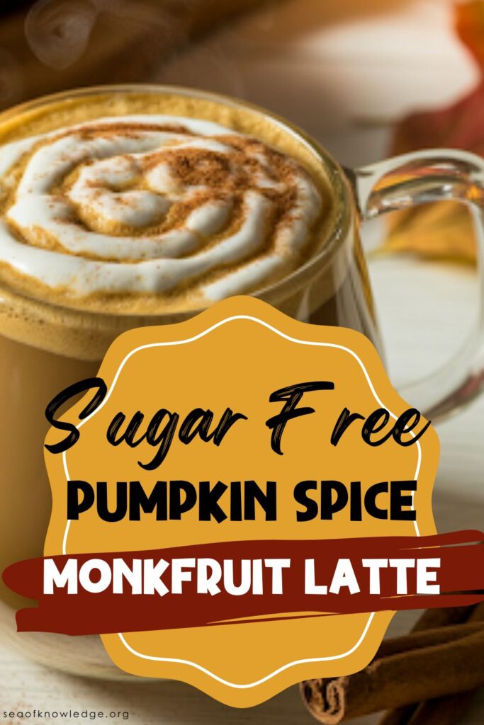 Overhead shot of a cozy pumpkin spice monkfruit latte with latte art and warm autumn spices like cinnamon and nutmeg around the mug.