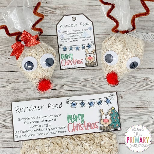 Decorated reindeer food bags with red noses, pipe cleaner antlers, and printable gift tags