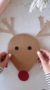 Paper reindeer race craft with antlers, eyes, and a red nose