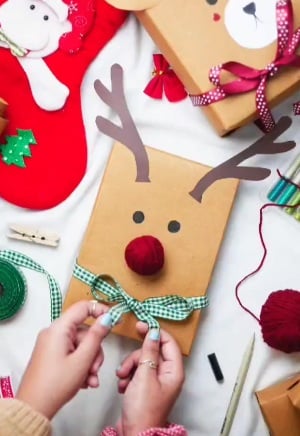 Christmas gift wrapping decorated to look like a reindeer