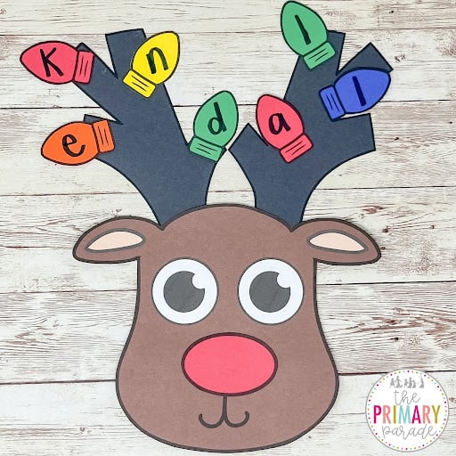 Reindeer name craft with letters written on colorful Christmas light bulbs