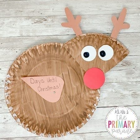 Brown paper plate reindeer with paper antlers, white eyes, and a red nose